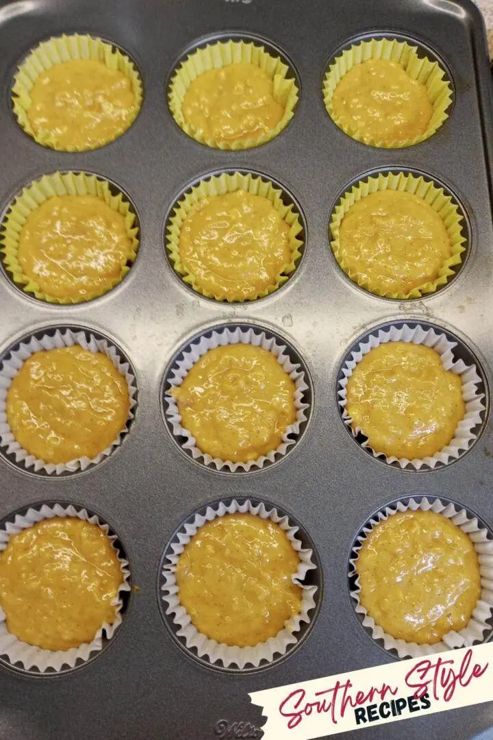Muffin pan filled with apple oatmeal muffin batter
