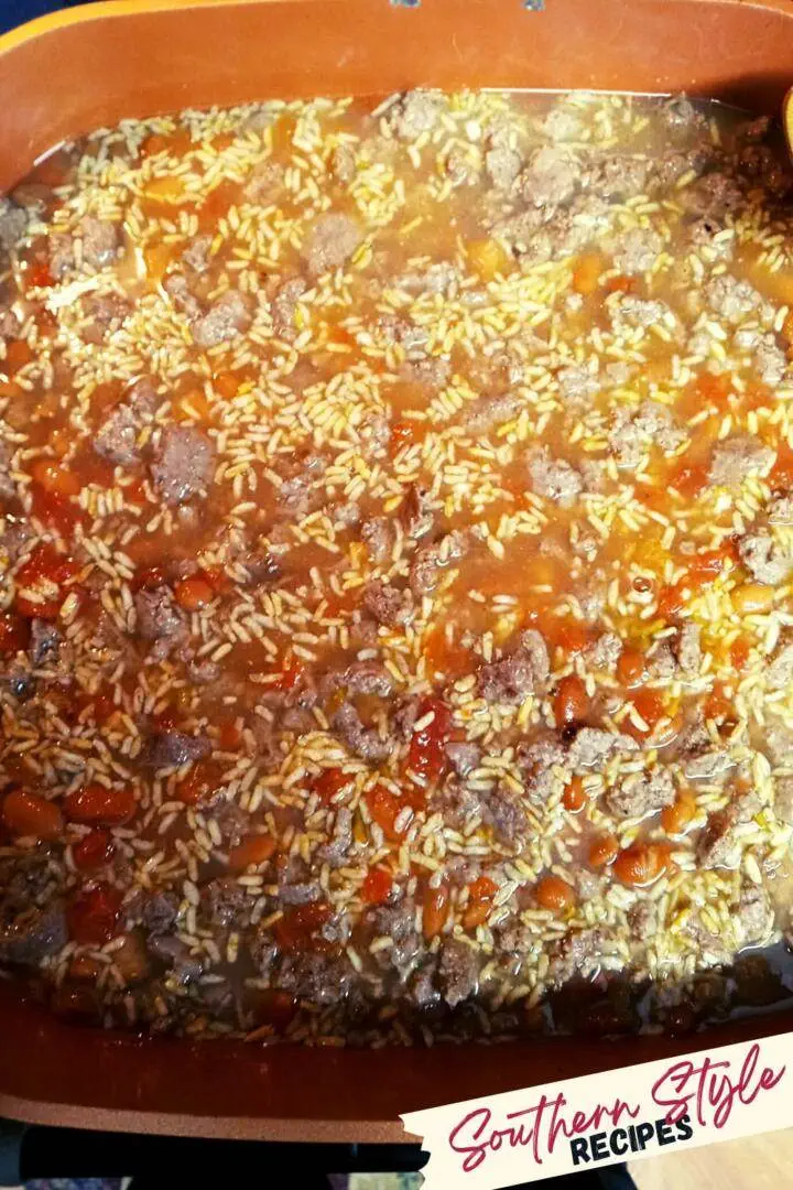 All ingredients for Mexican Beef and Rice Skillet in pan