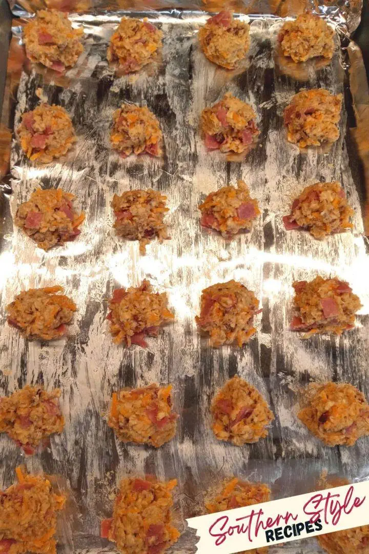 uncooked balls of breakfast take alongs on prepped sheet pan